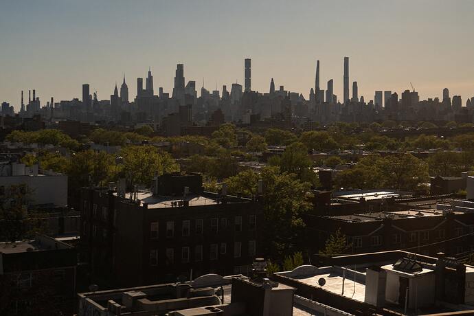 The Manhattan skyline is seen from Queens, New York