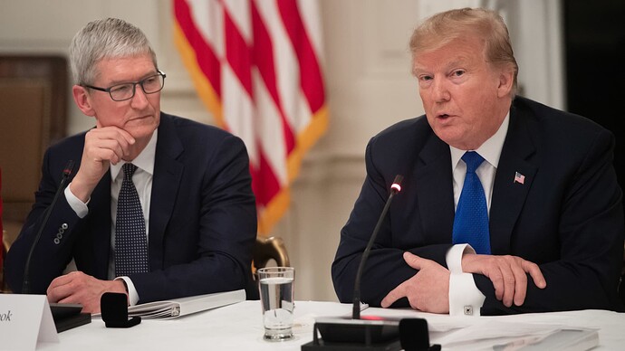 Donald Trump speaks alongside Apple CEO Tim Cook (L) during the first meeting of the American Workforce Policy Advisory Board in the State Dining Room of the White House in Washington, DC, March 6, 2019.